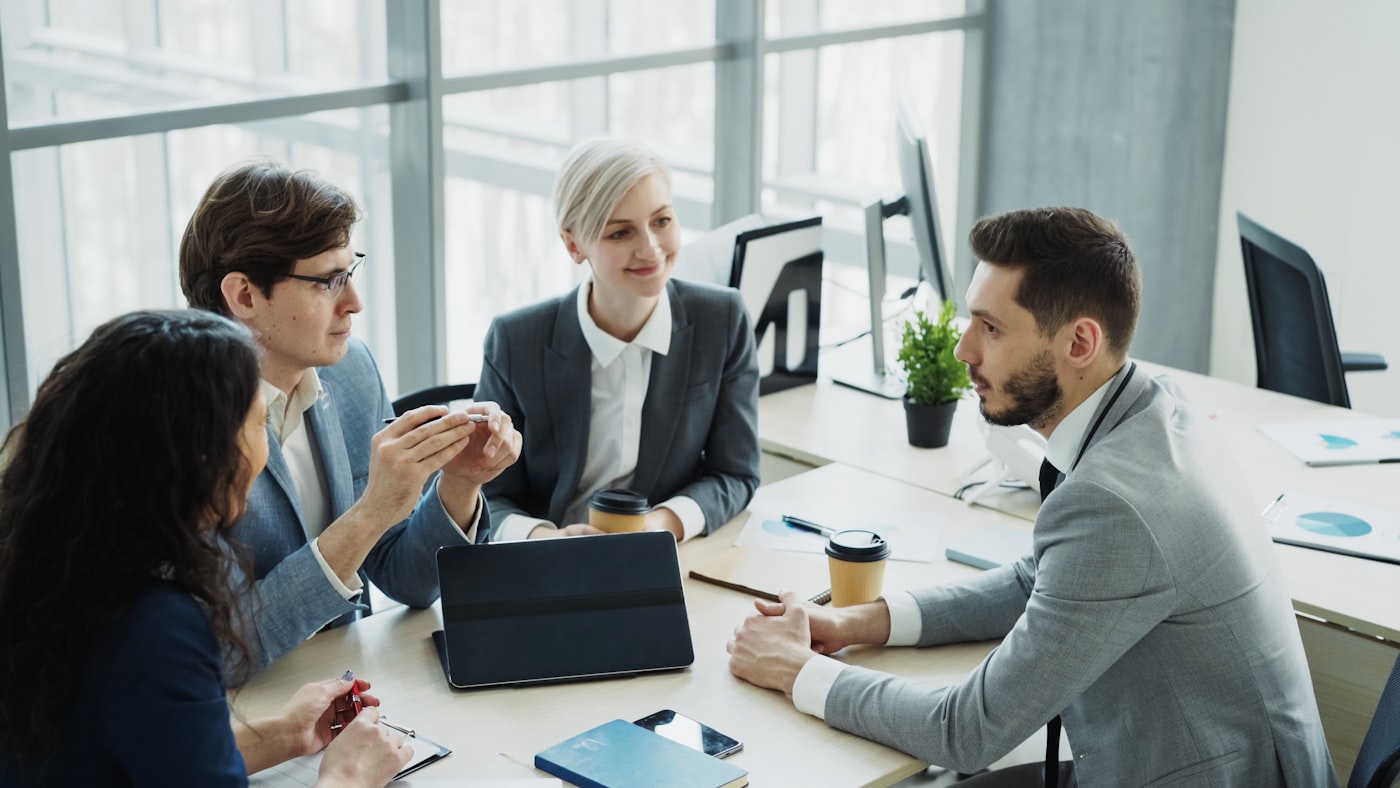 Team collaborating around a meeting table